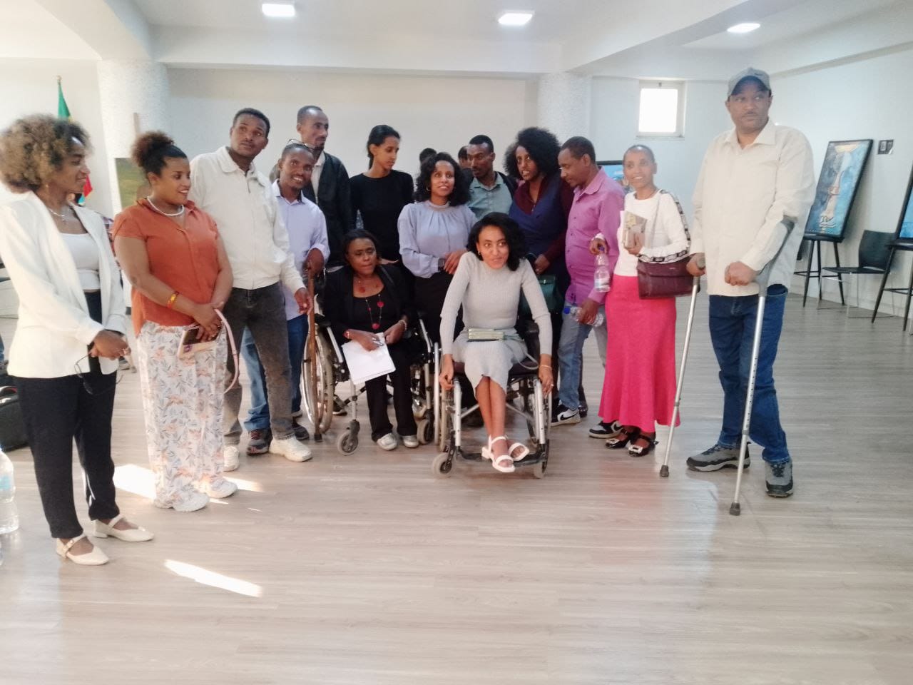 A diverse group including persons with disabilities working together in an inclusive co-design workshop