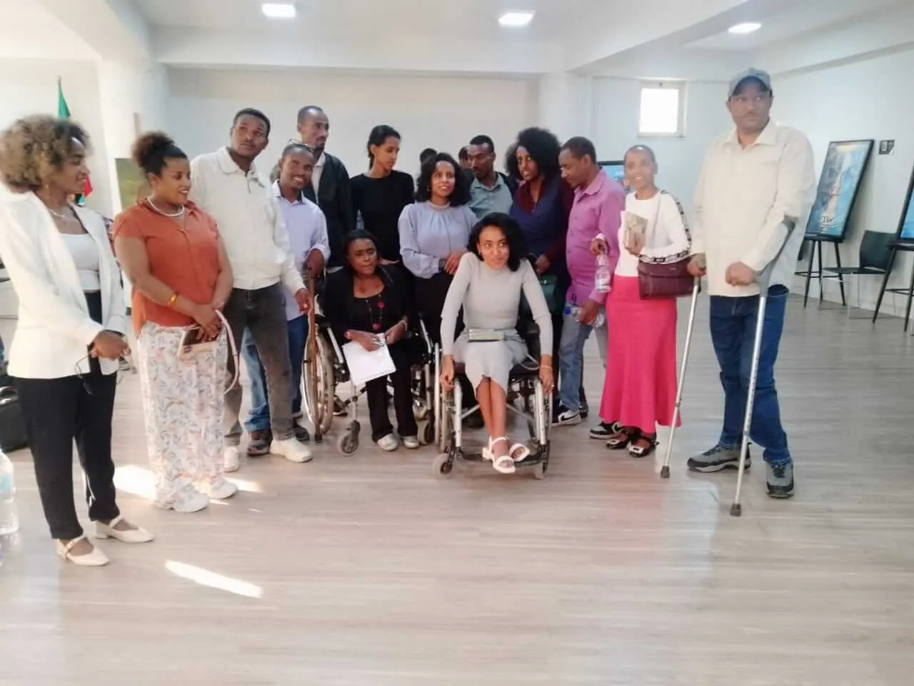 A diverse group including persons with disabilities working together in an inclusive co-design workshop